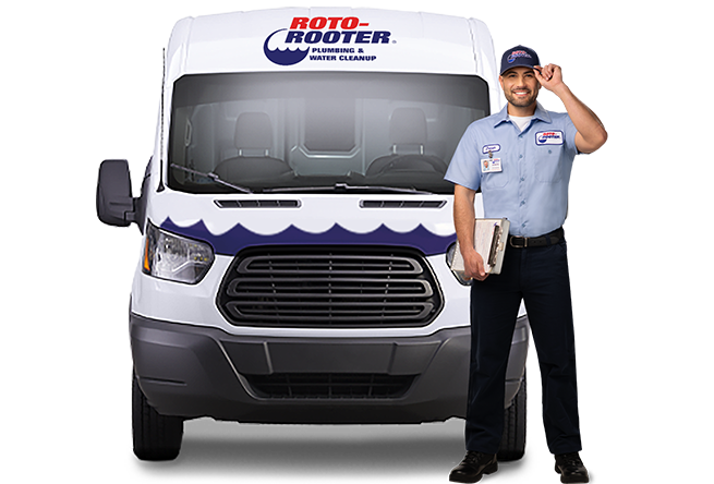Roto-Rooter technician in front of van tipping hat holding clipboard