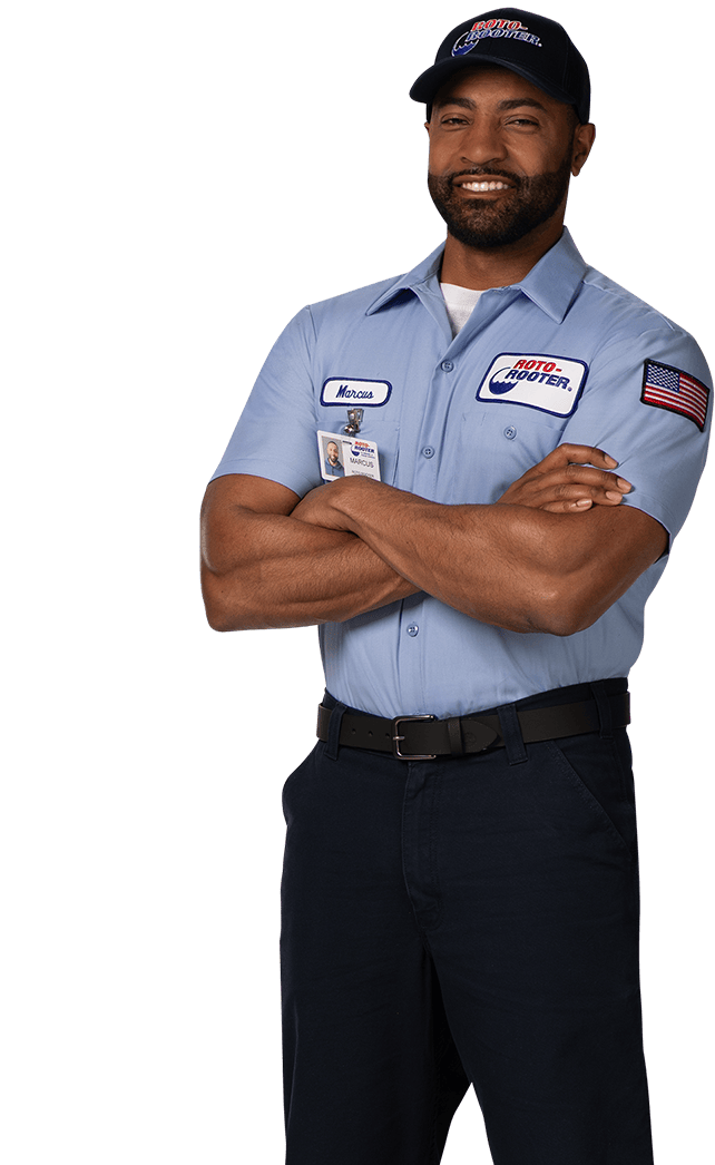 Roto-Rooter technician with arms crossed