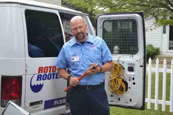 Jason Hawes Ghost Hunter in front of Roto-Rooter van