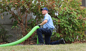 Roto-Rooter technician working hard on cleanup