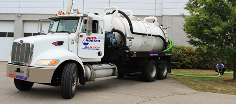 Roto-Rooter Plumbing Truck harboring drainage input from technician